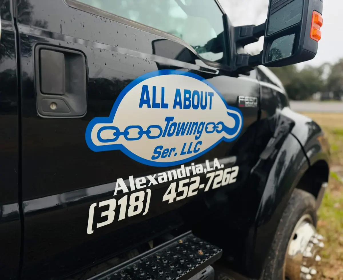 All About Towing truck door with company logo