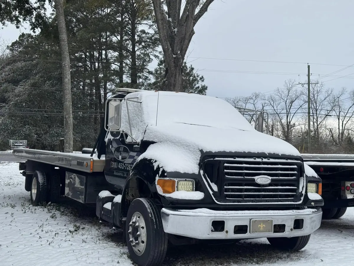 All About Towing truck working in winter weather