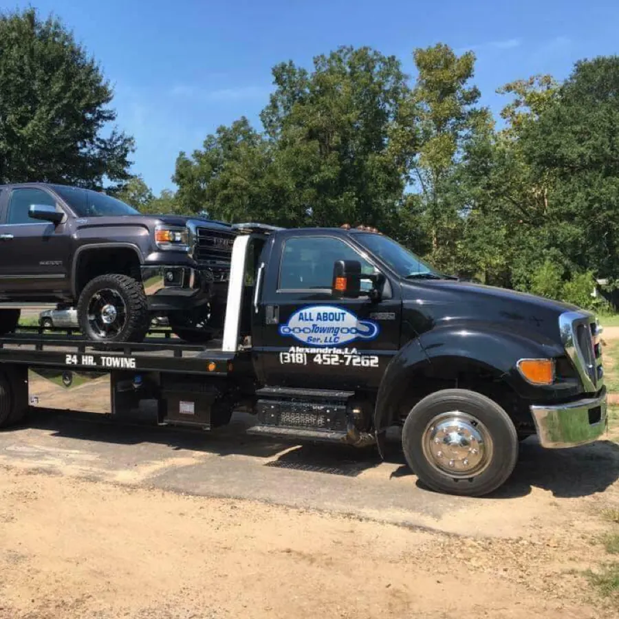 Clean, well-maintained All About Towing tow truck